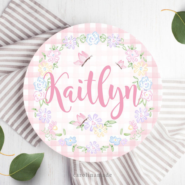 This 10 inch plate features a pink gingham background with a floral wreath, butterflies and your childs name personalized in the center.