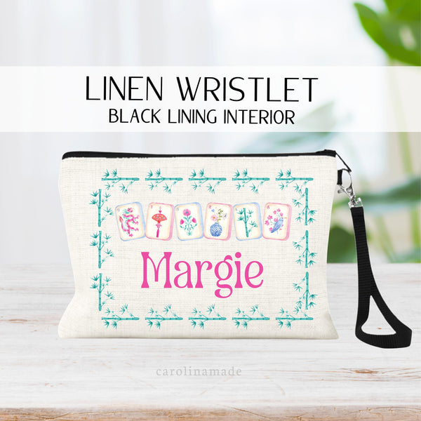 Personalized linen zipper pouch perfect for mahjong game night! This bag features your name and beautiful vibrant mah jongg tiles with a bamboo frame around it.