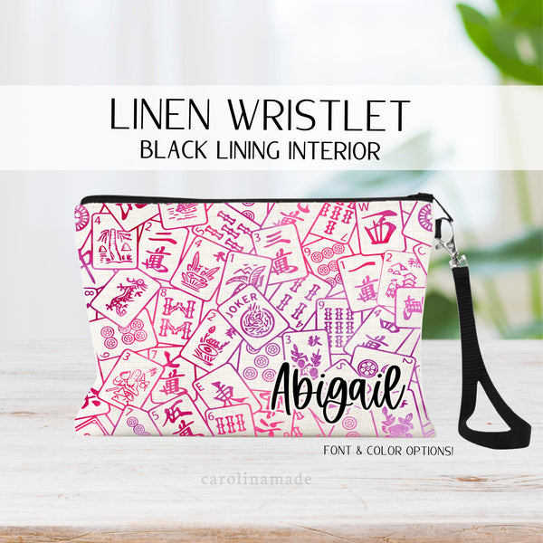 This linen wristlet zipper pouch features a mahjong cards covering the whole bag and personalized name at the bottom. Choose your colors and font.