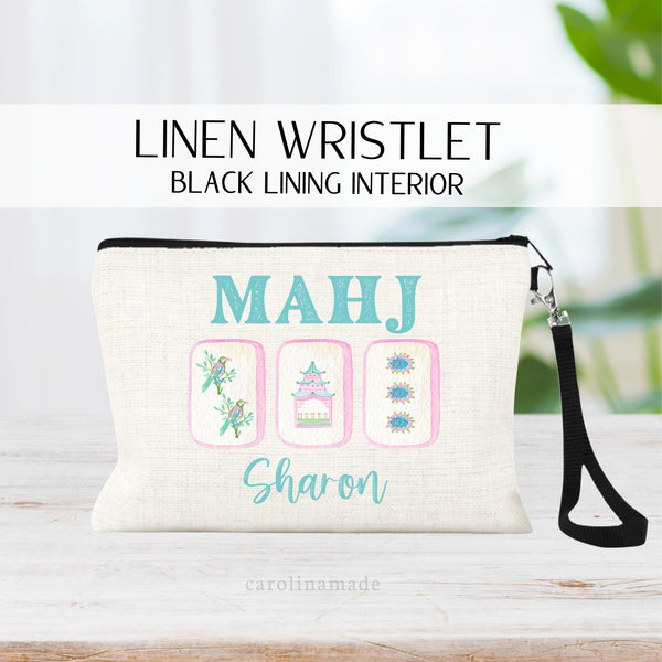 Personalized linen zipper pouch perfect for mahjong game night! This bag features your name and beautiful vibrant mah jongg tiles.  The top says MAHJ. And the colors are a fun pink and teal design.