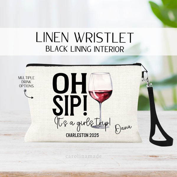 This linen zipper pouch with black strap features the text Oh Sip Its a girls trip! With the destination and current year. Personalize with your name in the corner. There is a large alcoholic drink in the background that you get to choose!