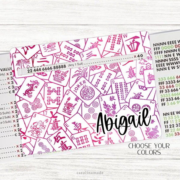 This acrylic mahjong line reader features a white background with your choice of tiles that cover the entire board.  The bottom corner is personalization with your name. Matching zipper pouch available also.