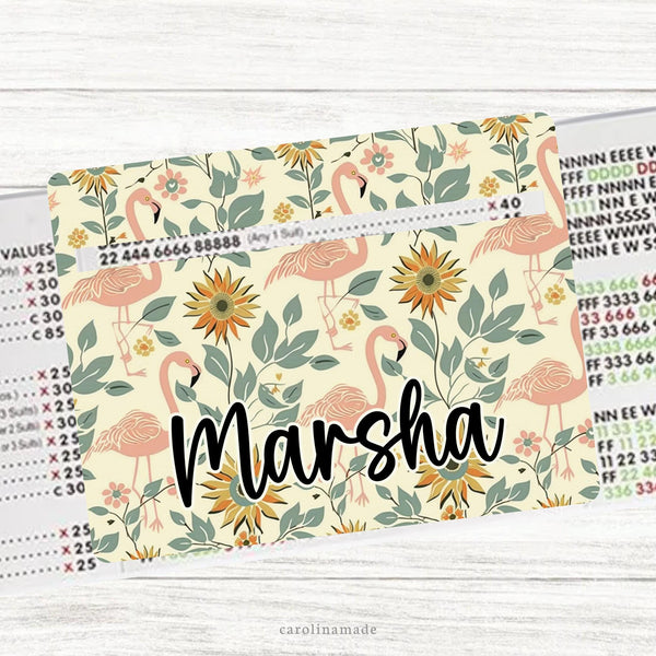 This acrylic mahjong line reader features a cream background with sunflowers and flamingos and your personalized name. Check out our mahjong zipper pouches to carry your line finder