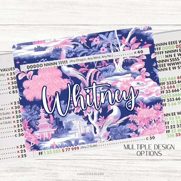 This acrylic mahjong line reader features a blue and pink chinoiserie floral theme. There are 7 design choices to choose from. It is personalized with your name.