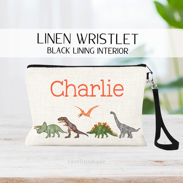 This fun kids linen zipper pouch works perfect for back to school to carry pens and pencils in their backpack. This bag features a row of dinosaurs across the bottom. And their personalized name at the top.