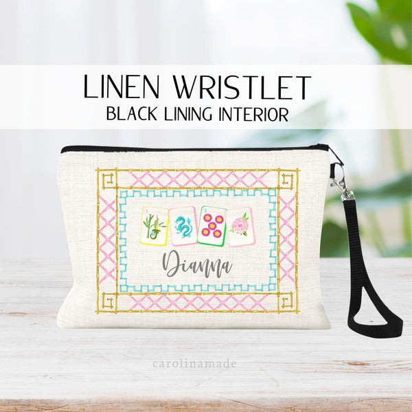 This Mahjong themed linen zipper pouch features a colorful bamboo border of gold, pink and turquoise. The center has 4 different fun mahjong tiles  with dots, bams, dragon, flower, cranks. Under the tiles it is personalized with your name.
