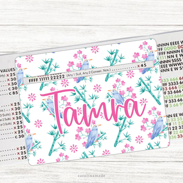 This acrylic mahjong line reader features a white background with bamboo, flowers and birds. The center is personalization with your name. Matching zipper pouch available also.