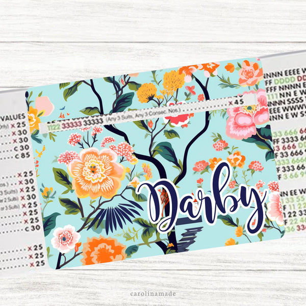 This acrylic mahjong line reader is colorful with a mint colored background with branches and flowers. The bottom is personalization with your name. Several mahjong zipper pouchs available also.