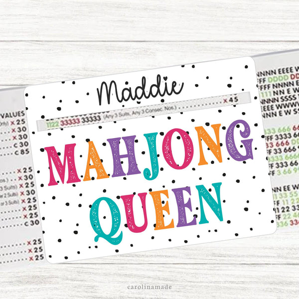 This acrylic mahjong line reader features a white background with black dots and colorful text that says Mahjong Queen. The top is personalization with your name. Matching zipper pouch available also.
