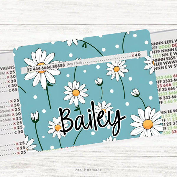 This acrylic mahjong line reader features a teal background with white daises and your personalized name at the bottom. Check out our mahjong zipper pouches to carry your line finder