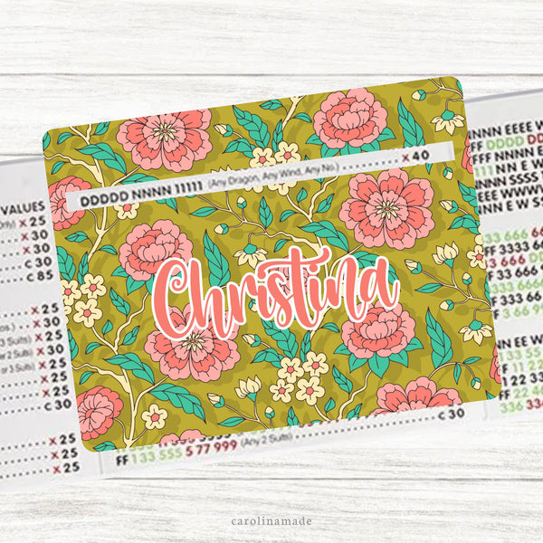 This acrylic mahjong line reader features a gold chinoiserie floral theme. It is personalized with your name.