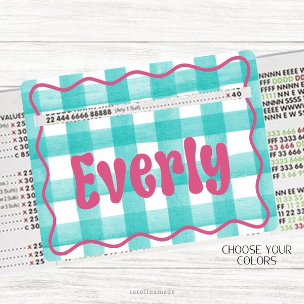 This acrylic mahjong line reader features a gingham background with a wavy border and your personalized name in the center. Choose your colors!