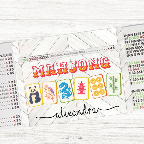 This acrylic mahjong line reader features a wood background and colorful mahjong tiles. Your name is personalized at the bottom. Matching zipper pouch available also.