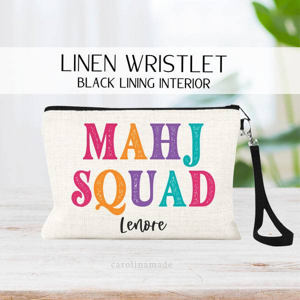 This linen zipper pouch features colorful text that says Mahjong Squad. It is personalized with your name at the bottom. Perfect for your mahjong group and game night!