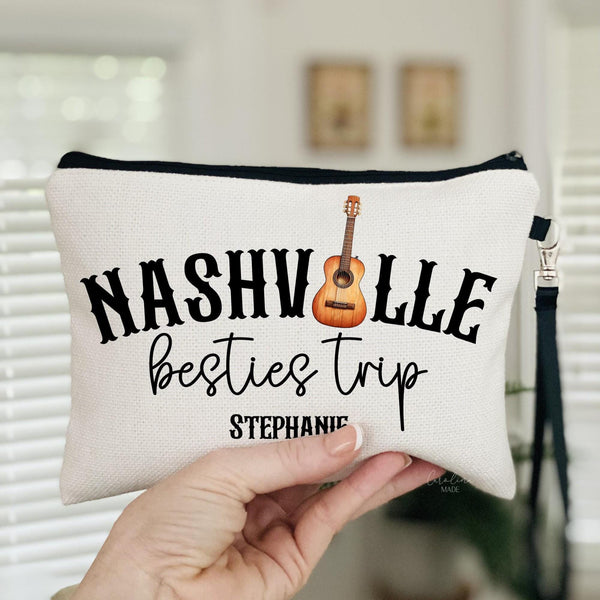 This linen zipper pouch features Nashville across the top with a guitar as the i. The text under it says besties trip and can be personalized to say girls trip, sister trip, etc.  Personalize your name at the bottom.