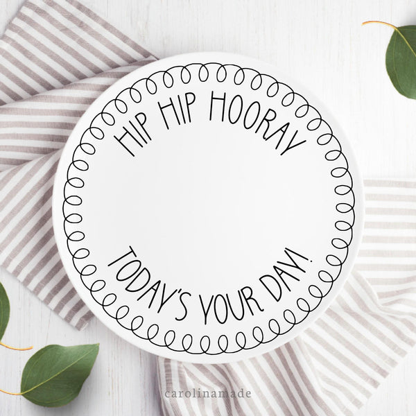 This white frame features a black and white design. There is a doodle frame around the outside of the plate with the text in the center. Text can be customized.